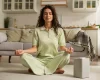 full-shot-woman-meditating-home_23-2149936251
